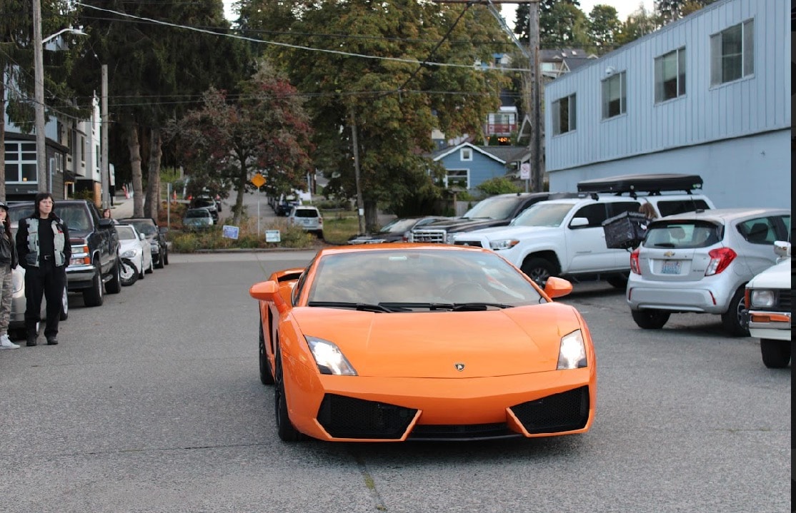 Orange Lamborghini rolling down a Seattle street